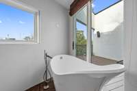 Relax in this tub while taking in the views from above the trees.