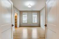 Fifth bedroom can also serve as an home office. Closets have wood custom built-ins throughout