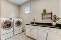 Not one but two laundry rooms with ample storage