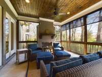 Screened in sunroom with fireplace