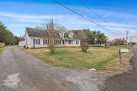 Street view of this home. Front view of this wonderful home.  New shutters. New Pella Windows.