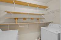 The laundry closet has lots of extra shelving.  Plus Washer and Dry come with this home.