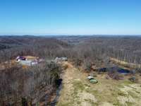 This drone shot captures the home, garages, pool and the pond; all nestled within the 41 acres.