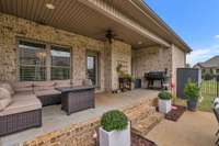 Back porch living with fenced yard.