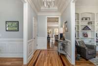 Beautiful entry way with beautiful custom crown moldings and trey ceiling.