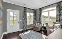 Inviting, bright sunroom - so many great ways to use the space!   Photos are of a model of the same floorplan. Colors and finishes will vary.