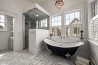 Heated floors and steam shower compliment this primary bathroom