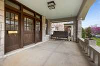 Large covered front porch with swing