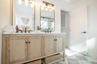 Double vanity in luxurious primary ensuite bathroom