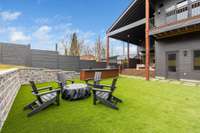 Turf throughout lower level of the yard and natural grass above for pups or play.  Every area of this home has a view.