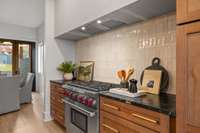 6 burner Viking gas stove and hidden hood for the chef of this luxury cooking space.