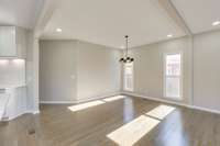 All NEW solid white oak wood floors, high ceilings—and windows fill this home with delightful natural light.