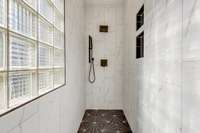 Make the Shower Pop! Quartz shower walls are luxurious looking and provide long-life durability.