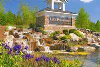 Impressive waterfall entrance to the gated Del Webb Lake Providence 55+ community.