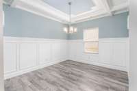 Gorgeous Formal Dining Room with coffered ceilings and so much beautiful trim work