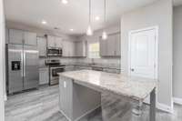 Stainless Steel Appliances, Granite Countertops and a Huge Island