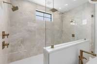 Open rainfall shower with amazing over-sized quartz tile