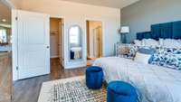 From corner of main bedroom. The walk in closet is the door on the left and the main bathroom is on the right. Pictures are of previously completed home of same floorplan. Features may vary.