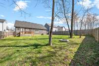 The backyard features a fire pit and is fully fenced!