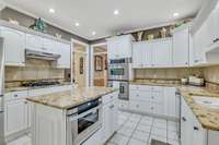 Stainless Steel Appliances, Gas Stove, Drawer Microwave, Double Oven and Granite Countertops.