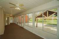 The large sunroom goes from the primary bedroom door, across the back of your home all the way to the kitchen door! Talk about an incredible space! There are so many wonderful ways to enjoy this extra treat of living space! And that view!