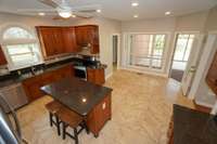 Heading into the kitchen, you're met with tons of counter space and cabinet storage! Stainless steel appliances and granite countertops, along with space for a kitchen table!