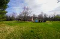 Another view from this expansive backyard shows the shed that is perfect for storing all your outdoor tools and equipment!