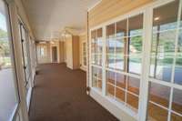 Another view to show just how expansive this sunroom truly is! This just may be where you decide to spend most of your time! Heated and cooled, and fully enclosed, you can enjoy this wonderful spot all year long!