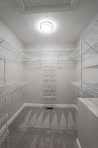 Your primary walk in closet is equipped with all the organizational tools needed to keep your wardrobe neat and tidy!