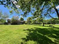 Back view of the home  - large back yard - plenty of room for a pool, garden, etc...!