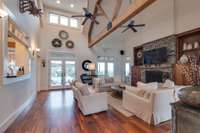 Custom walnut floors with visible rustic nail heads. Beams and iron add rustic architectural appeal as well.