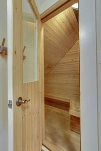 Sauna is adjacent to exercise room. Low EMF, ceramic and carbon fiber heaters.