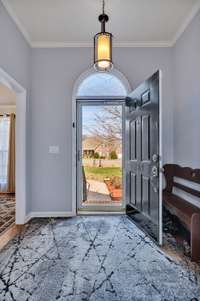 The entry way of this beautiful home is adorned with crown molding, perfectly complemented by an inviting entryway light fixture.  209 Fieldstone Dr.   Murfreesboro, TN 37127