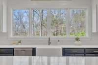 Backing to trees, enjoy your new private oasis with breathtaking views from the windows above your kitchen sink!