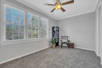 This third bedroom has enviable tree views out the triple window.