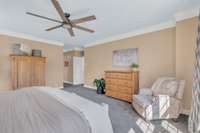 New ceiling fan light fixture and crown molding help highlight this room.