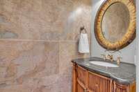 This handsome powder room serves guests on the main level.