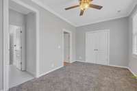 Another view of the third bedroom, with a double door closet.