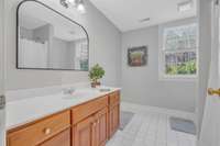 This large full bath has tiled floor and bathtub/shower combo. The walk-out, basement can be a welcoming space for hosting guests or an in-law suite.