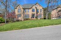 Framed by mature trees and located on a cul de sac in Highland Park of Raintree.