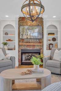 The gas fireplace creates a beautiful textured focal point and sense of warmth at the heart of this home.