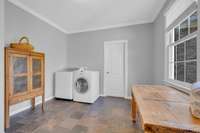 This upper laundry room can be converted back to its original use as a 6th bedroom, with bathroom access. (Another laundry room option is on the main level.)