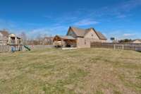 Here is yet another view of the super spacious backyard... again fully fenced in.