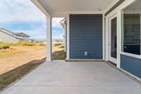 Covered porch with outlet in ceiling for hanging patio lights!