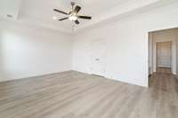 Owner's retreat- plank flooring extends into this bedroom.