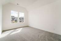 Another front bedroom with 11 ft raised ceiling and a big walk-in closet!