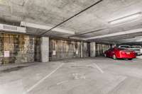 One assigned parking space in the gated owners' garage conveys with the sale as well