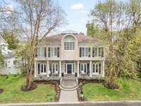 Mature trees and beautiful landscaping...and a courtyard in front of this area makes it one of the most perfect locations within Sugartree. The HOA mows all of the front yards...bonus!