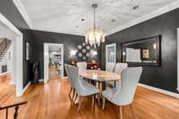 This dining room, to your right as you walk into the home, is so beautiful. The hardwood floors, the chandelier, the natural light, and the size of this room will make you want to plan when you can host the next holiday gathering!