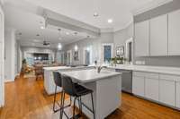 Lots of countertop space and a small island that is perfect for someone to sit and help with meal prep or just to mingle!